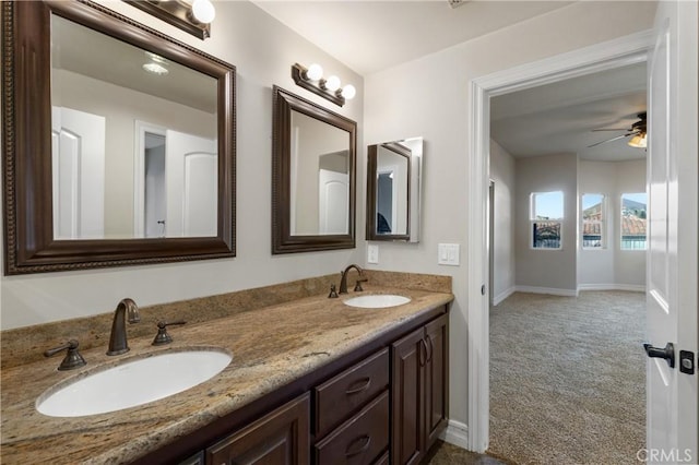 bathroom with ceiling fan and vanity