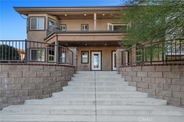 view of front of home with a balcony