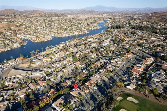 drone / aerial view with a water and mountain view