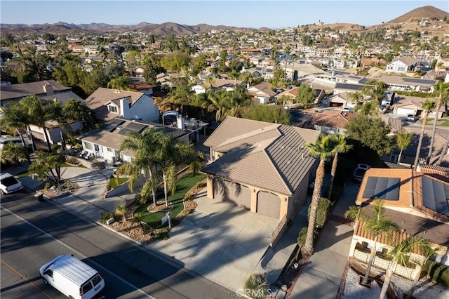 birds eye view of property with a mountain view