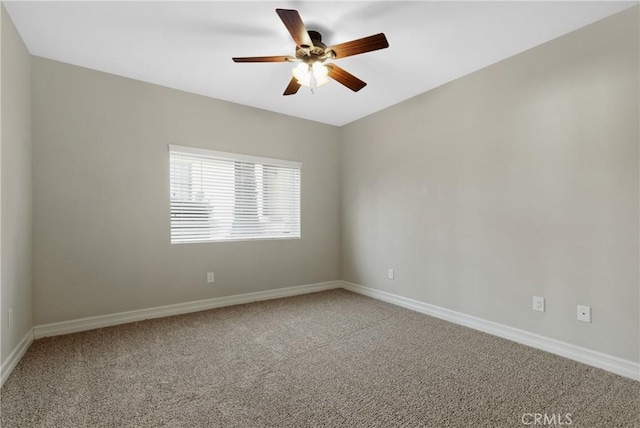 empty room with ceiling fan and carpet flooring