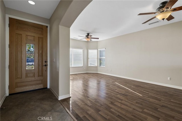 foyer featuring ceiling fan and dark hardwood / wood-style flooring