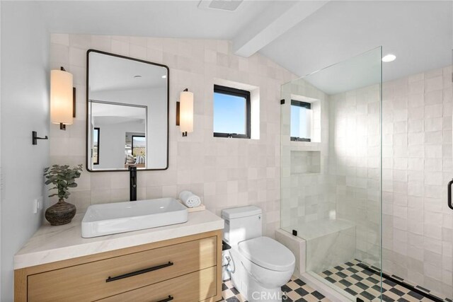 bathroom with toilet, tile walls, walk in shower, vanity, and lofted ceiling with beams