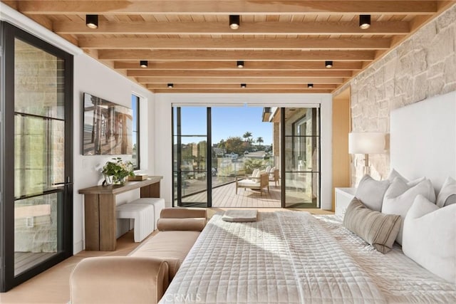 bedroom with wooden ceiling, access to exterior, radiator, and beamed ceiling