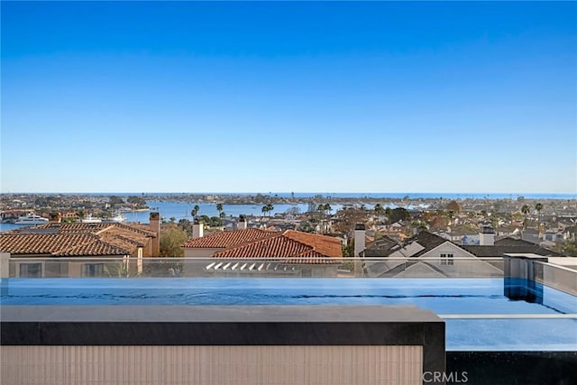 view of pool featuring a water view