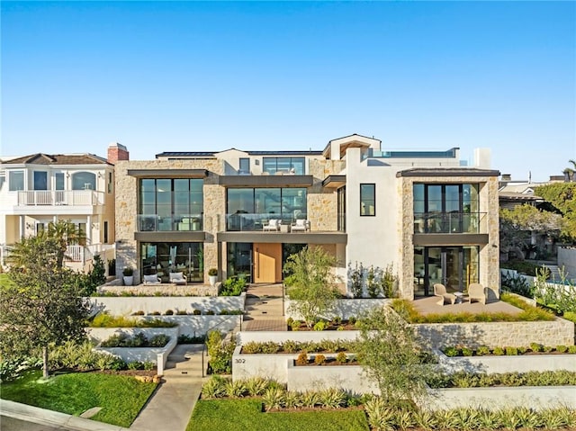 rear view of property with stucco siding