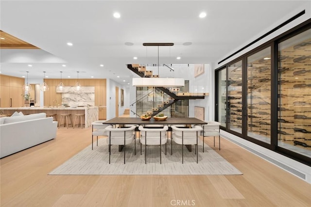 dining room featuring light wood-style flooring and recessed lighting