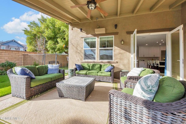 view of patio featuring ceiling fan and an outdoor living space