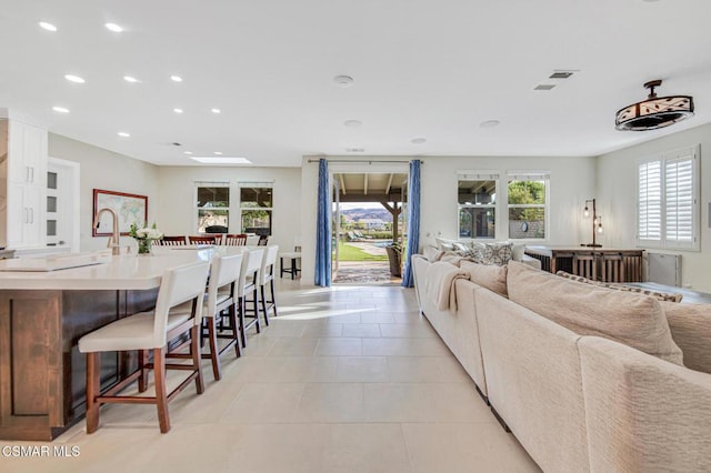 living room with light tile patterned floors