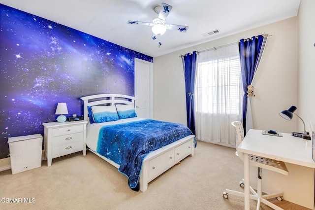 bedroom with ceiling fan and light colored carpet