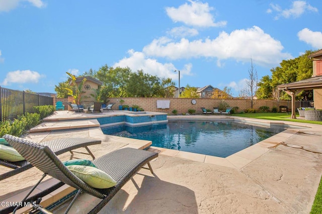 view of pool featuring a patio area, a hot tub, and an outdoor fireplace