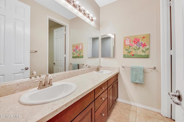 bathroom with vanity and tile patterned flooring