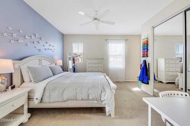 carpeted bedroom featuring ceiling fan