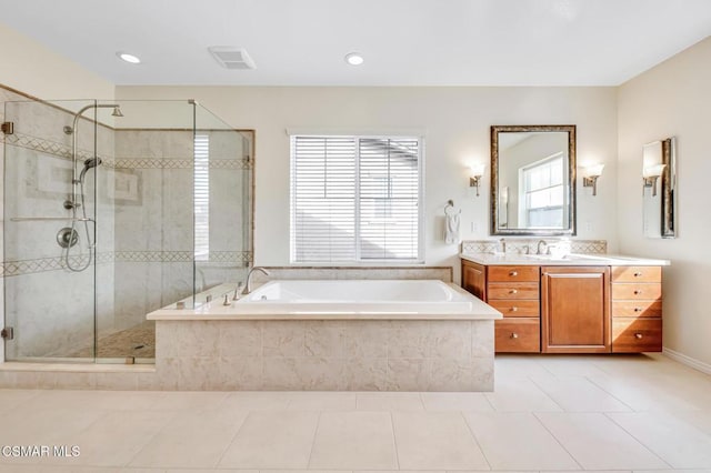 bathroom with vanity, independent shower and bath, and tile patterned flooring