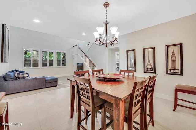 dining space with an inviting chandelier