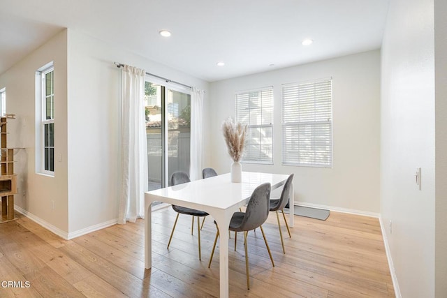 dining area with light hardwood / wood-style floors