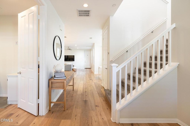 hallway with light hardwood / wood-style flooring