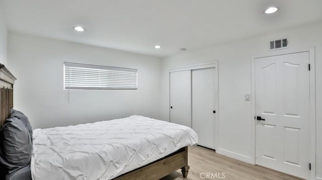 bedroom with light hardwood / wood-style floors