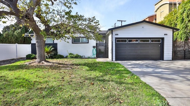 single story home with a front yard and a garage