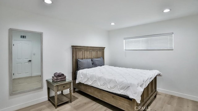 bedroom with light hardwood / wood-style floors