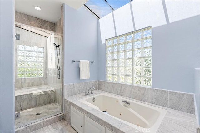 bathroom with shower with separate bathtub