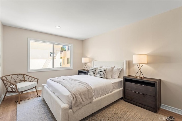 bedroom with wood-type flooring