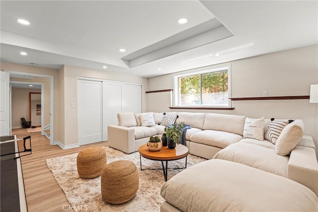 living room with light hardwood / wood-style flooring