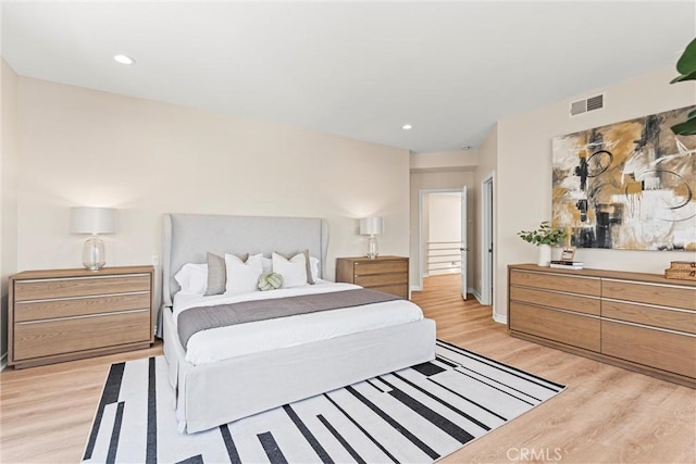 bedroom with light hardwood / wood-style floors