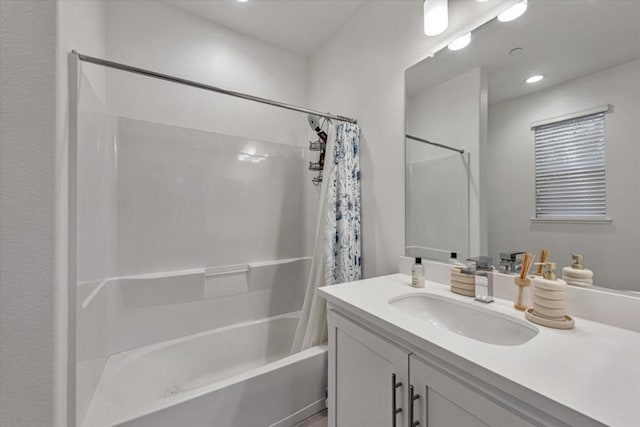 bathroom featuring vanity and shower / tub combo with curtain