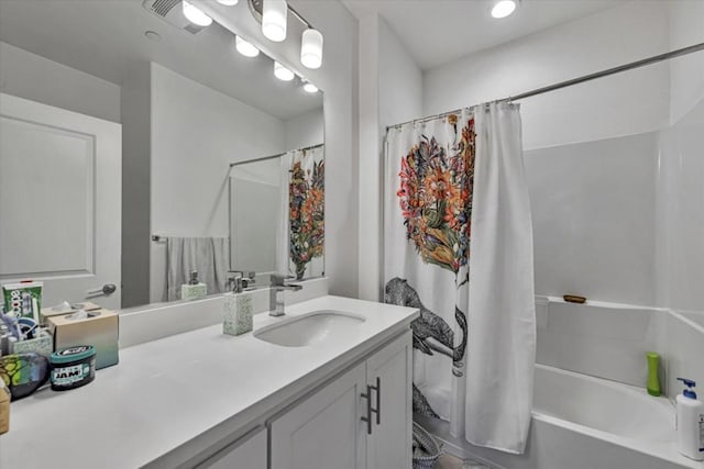 bathroom featuring vanity and shower / tub combo with curtain