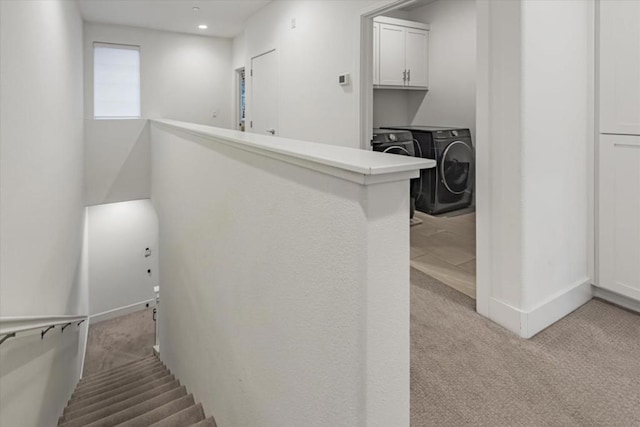 interior space with washing machine and dryer and carpet flooring