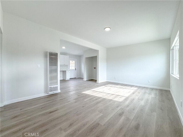 unfurnished living room featuring light hardwood / wood-style floors