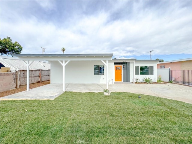 back of house with a yard and a carport