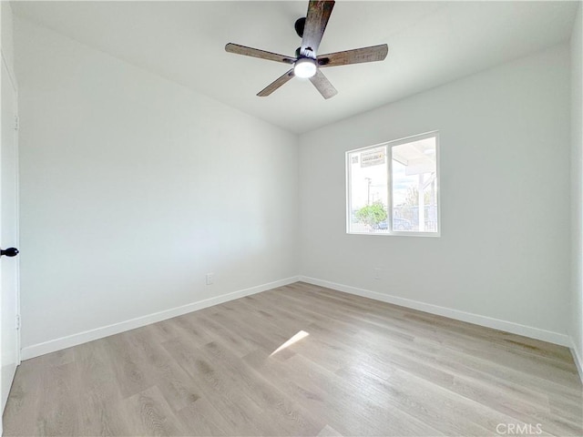 empty room with ceiling fan and light wood-type flooring