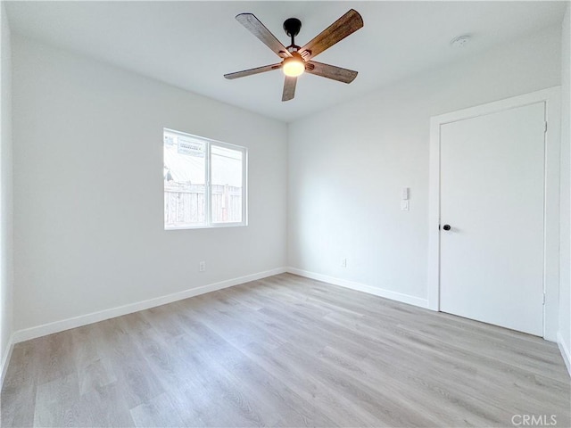 unfurnished room with ceiling fan and light hardwood / wood-style flooring