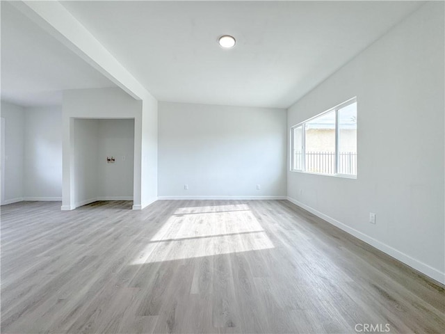 spare room featuring light hardwood / wood-style floors