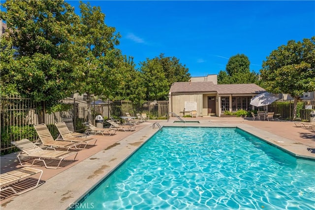 view of swimming pool with a patio area