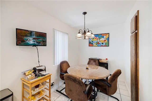 dining space with an inviting chandelier and light tile patterned floors