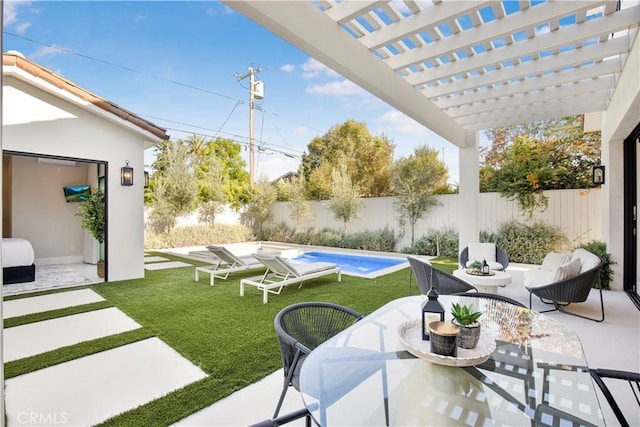 view of patio / terrace featuring a pergola and a fenced in pool