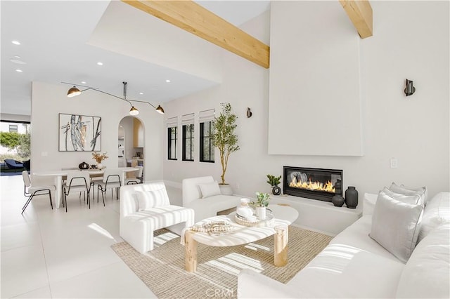 living room with lofted ceiling with beams