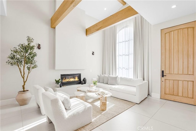 living room featuring light tile patterned floors and vaulted ceiling with beams