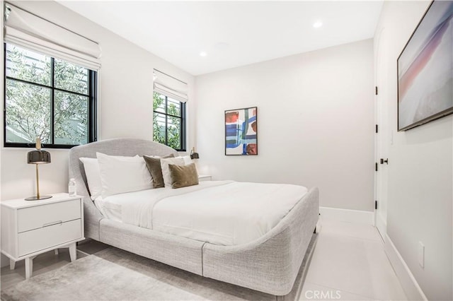 bedroom featuring multiple windows