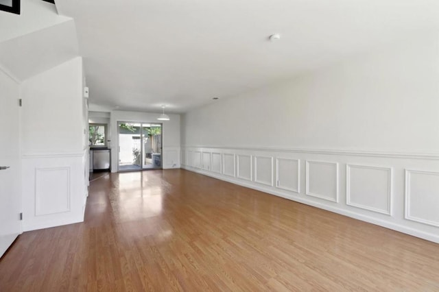 spare room with light hardwood / wood-style floors