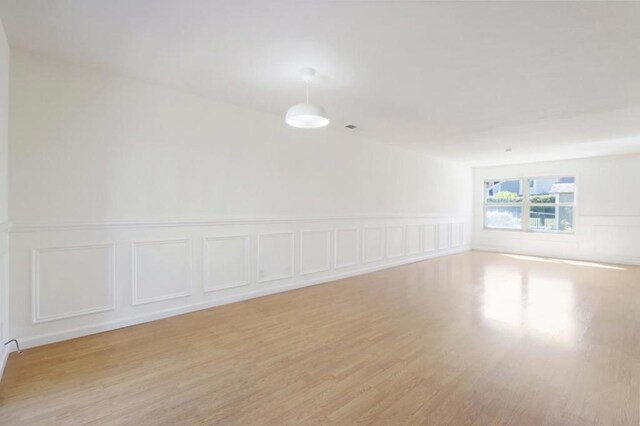 unfurnished room featuring light wood-type flooring