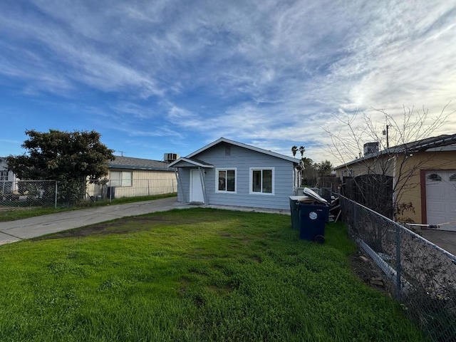 view of side of home featuring a yard