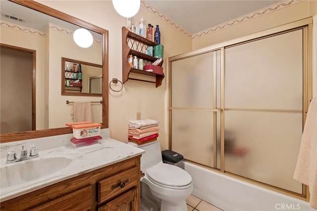 full bathroom featuring toilet, tile patterned flooring, enclosed tub / shower combo, and vanity