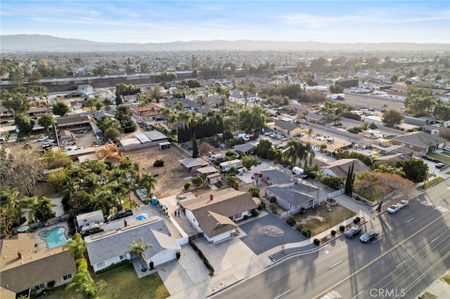 birds eye view of property with a mountain view