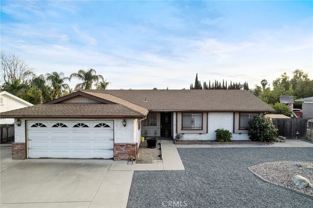 single story home featuring a garage