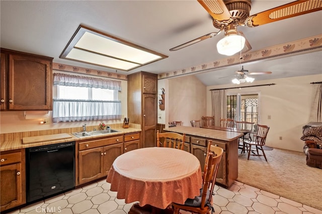 kitchen with ceiling fan, sink, dishwasher, and a healthy amount of sunlight