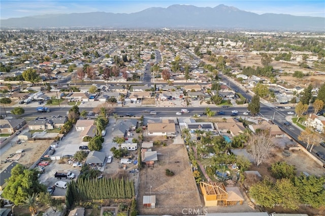 birds eye view of property featuring a mountain view